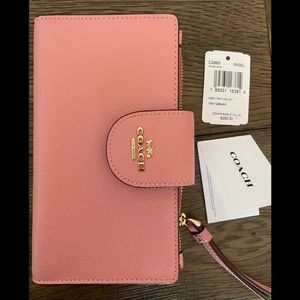 SOLD Pink Coach tech wallet NWT